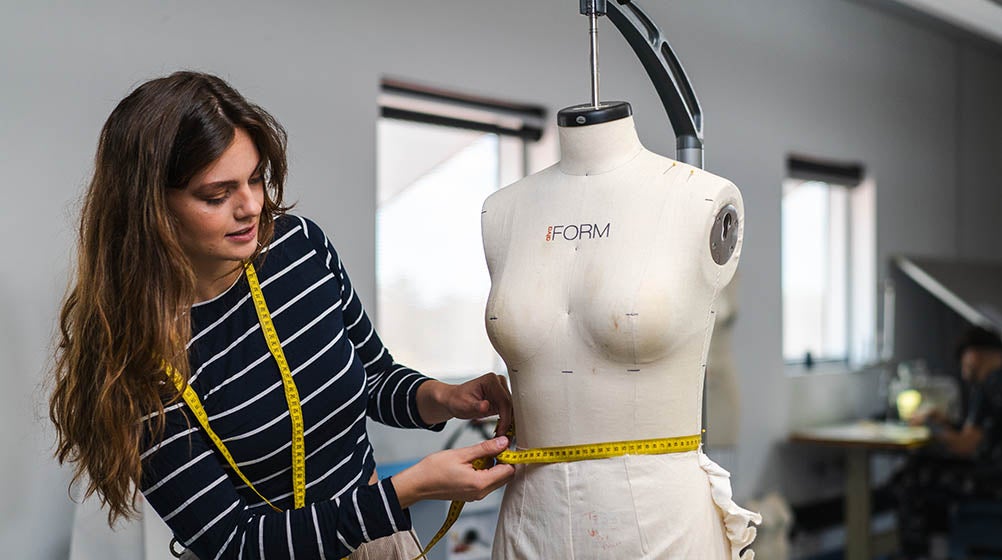 Holmesglen fashion student measuring waist
