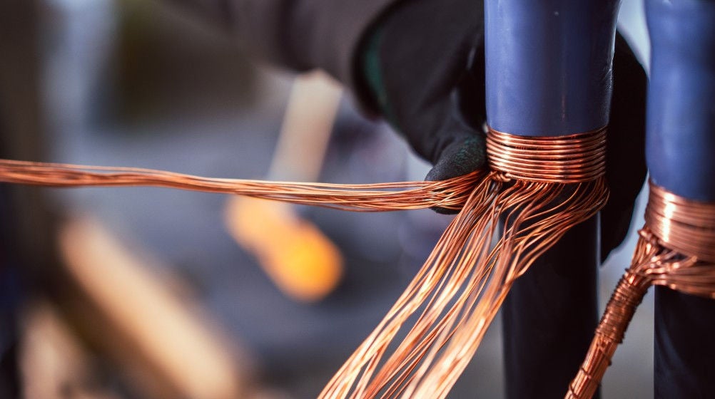 A student twists an electrical cable
