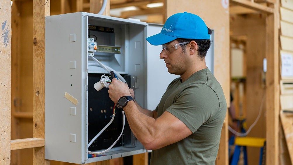 Electrical student completes task in a workshop