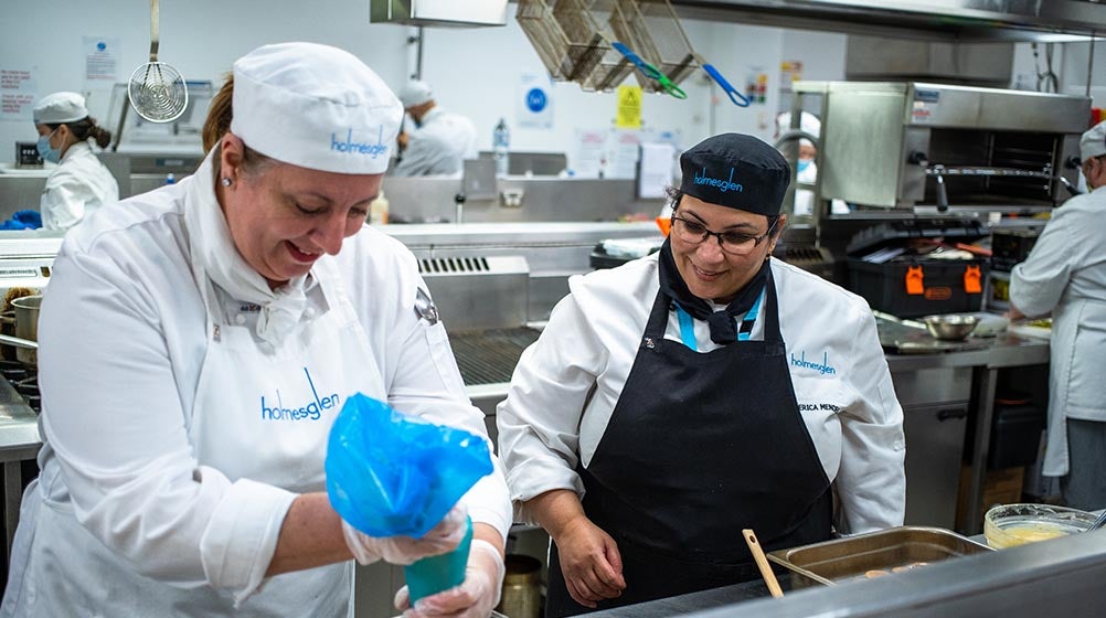 Image of hospitality students in the commercial kitchen at Holmesglen
