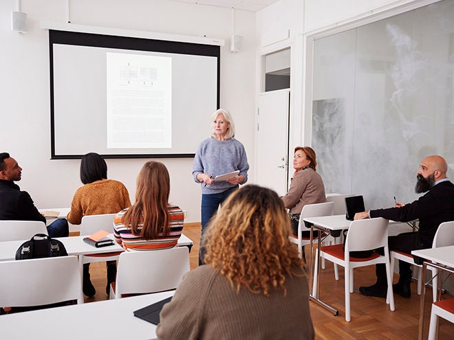 Woman giving presentation at seminar