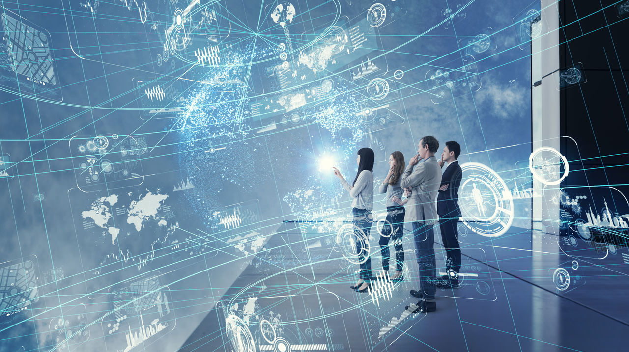 Group of people watching futuristic GUI.