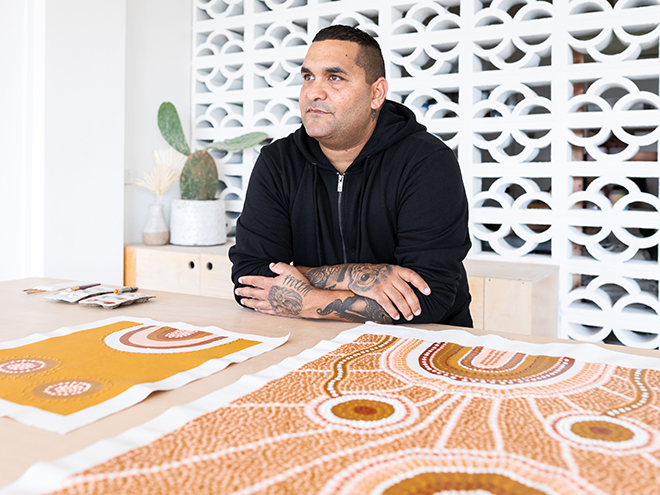 Indigenous Aboriginal Australian Artist Painting Indigenous Artwork In Studio